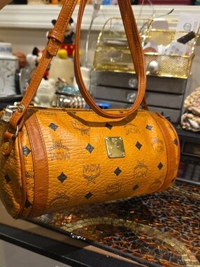 MCM authentic Cognac Visetos Barrel Shoulder Bag with Gold Plaque